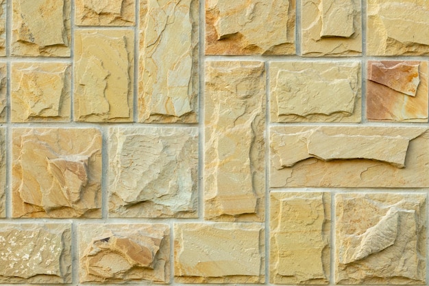 Solid beige and brown stone wall Suitable for background