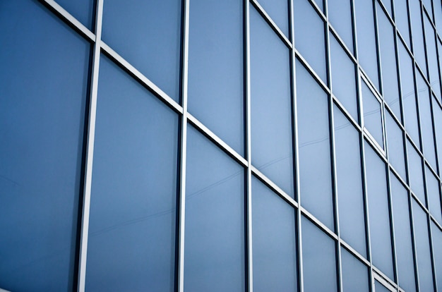 Solid blue windows of the office building. Glass wall