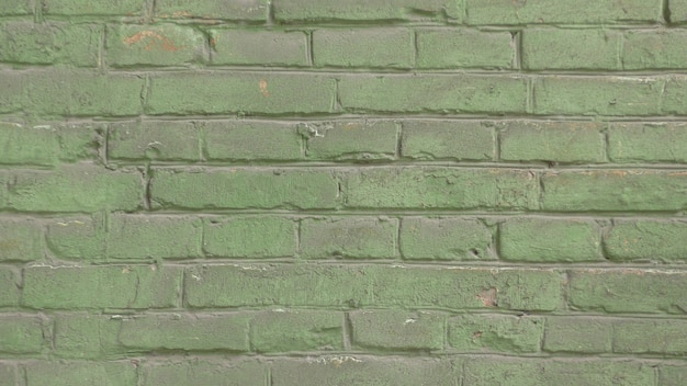 Solid Green Brick Wall Pattern Texture as Urban background and backdrop.