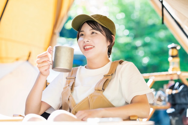 Solo camp image - Young woman drinking alcohol