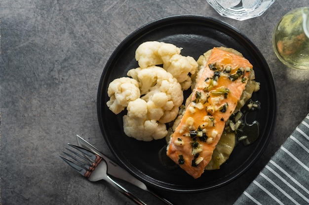 Solomon fillet with pineapple and cauliflower. Fish with vegetables. Copyspace.