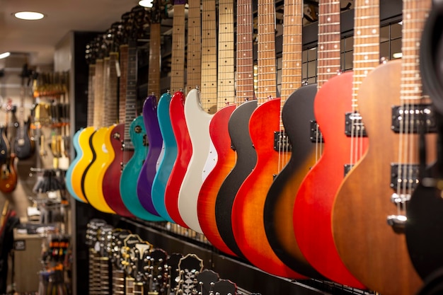 Solored electric guitars at showcase in music store