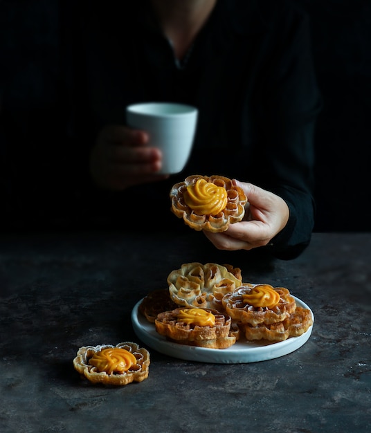 Solteritas or Flores de carnaval con crema, with cream, colombian cookies for Christmas and Easter