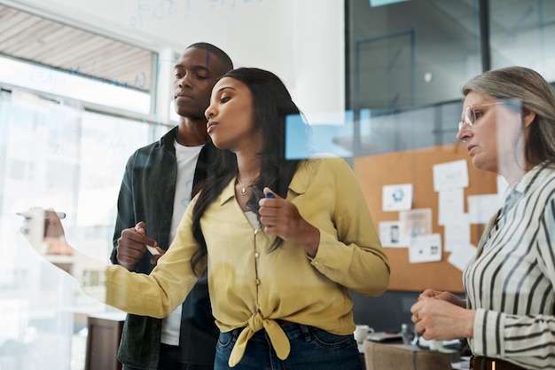 Solution to wealth disparity is not a faster train focus shot\
of a group of businesspeople brainstorming in a modern office