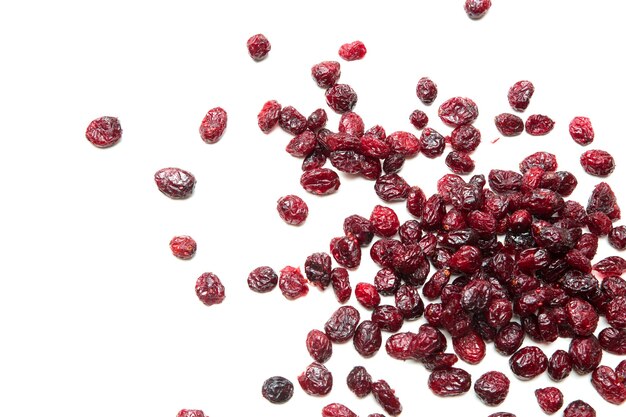 Some dried cranberries isolated on white.