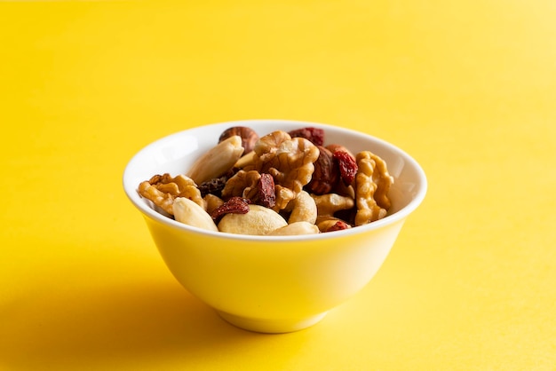 Some dried fruit on a yellow surface