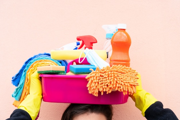 Some holding basin with cleaning supplies on the head, spring clean concept