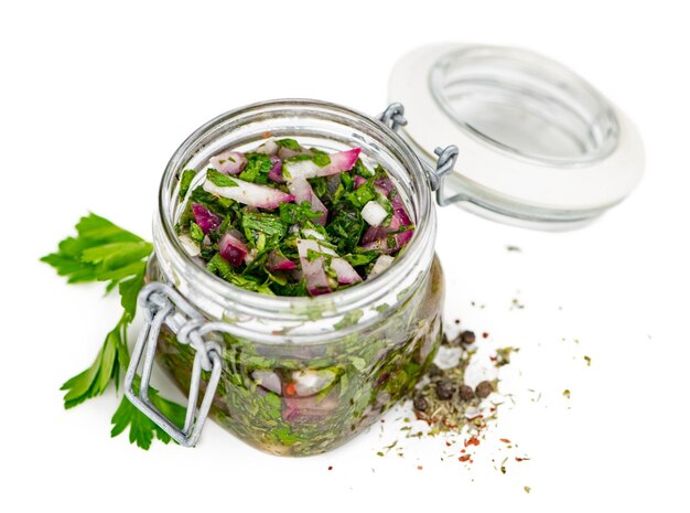 Photo some homemade chimichurri isolated on white selective focus