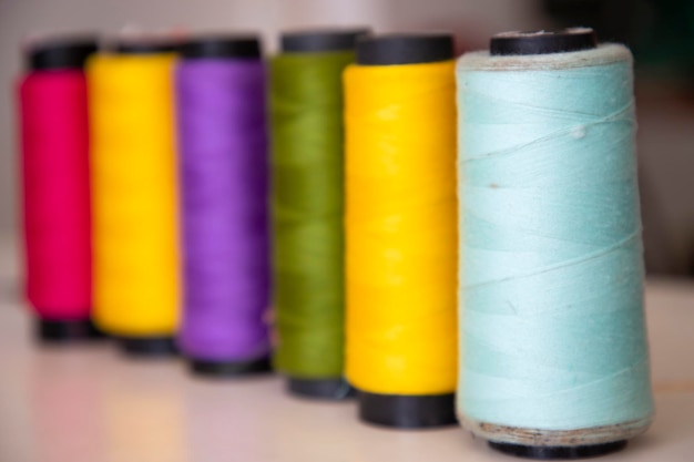 Some multicolor spools of swings thread closeup focus