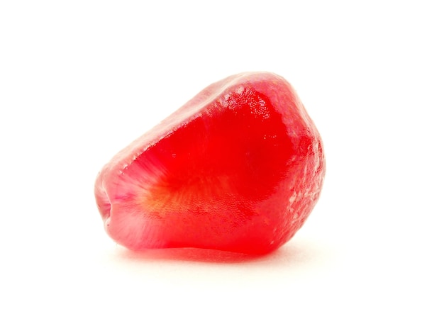 Some pomegranate berries isolated on the white background