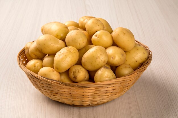 Some potatoes over a wooden surface. Fresh vegetable.