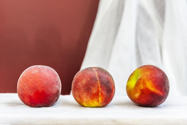 Some red peaches ripening