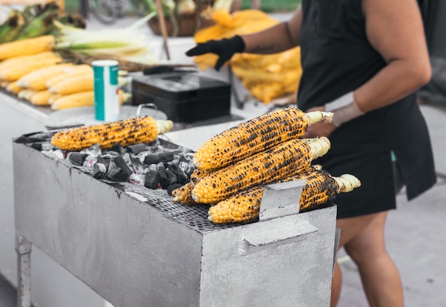 Some roasted ears of corn at a street food stall