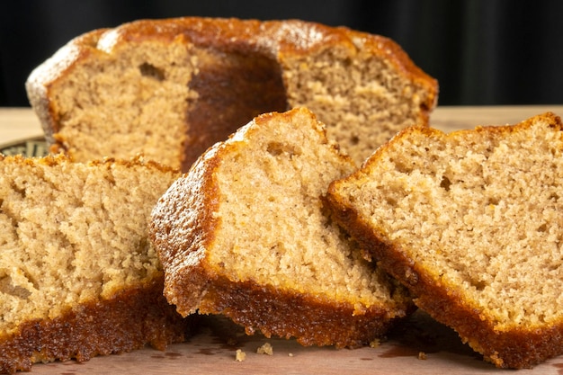 Some slices of a banana cake on wooden table.