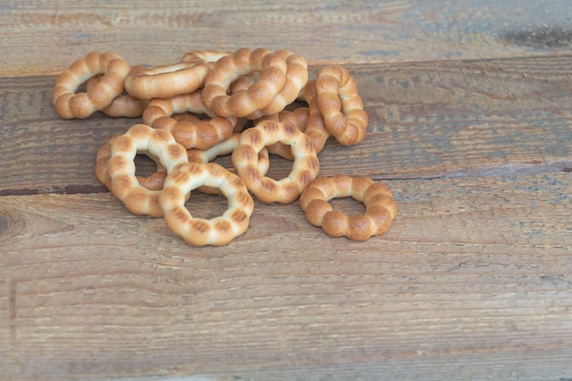 Some tasty bagels on wooden background with copy space