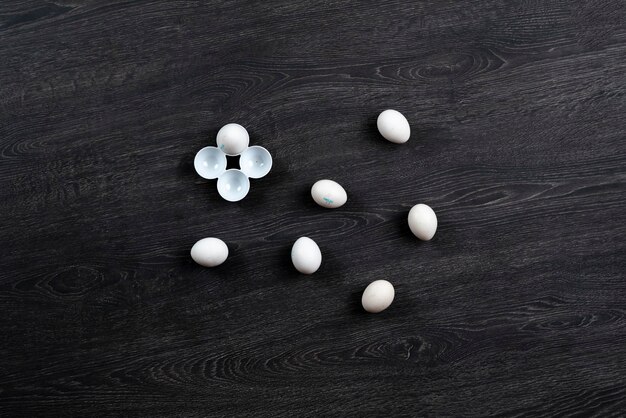 The some white chicken eggs flat lay isolated on the colorful surface