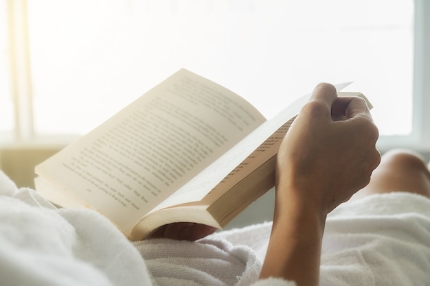 Someone reading on the bed