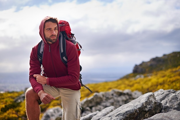 Sometimes you just gotta stop Shot of a young man enjoying a hike through the mountains