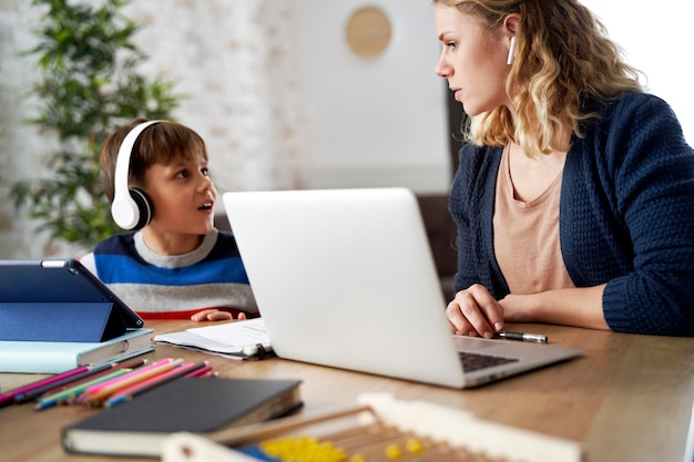 Son disturbs mom at home office