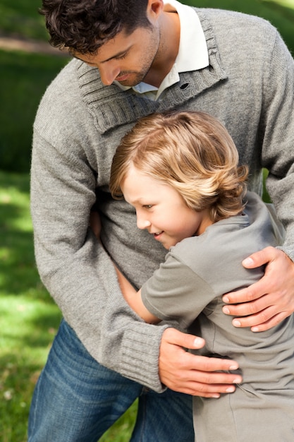 Son embracing his father