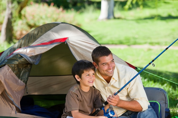 Son fishing with his father