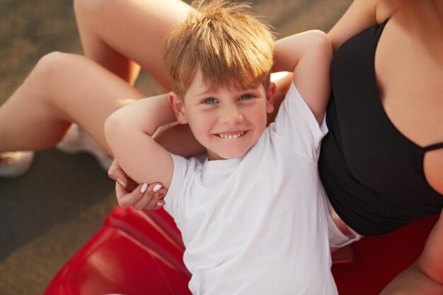 Son lying on knees of mother