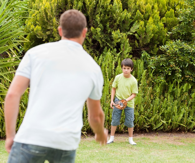 Son playing football with his father