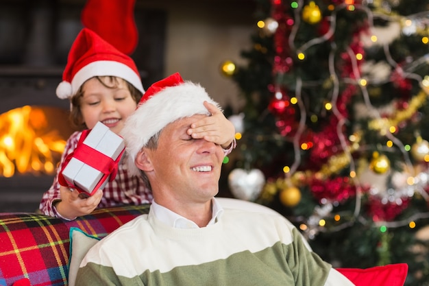 Son surprising his father with christmas gift