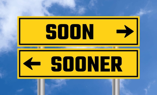 Photo soon or sooner road sign on blue sky background