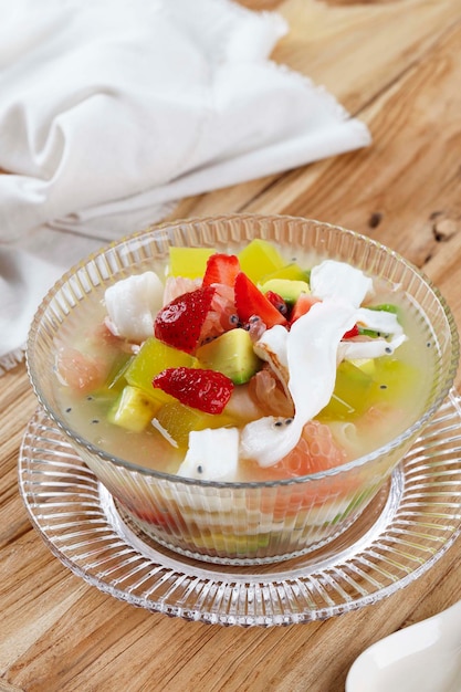 Sop Buah or Es Buah is Mixed Fruit with Coconut or Simple Syrup Served with Shaved Ice and add Condensed Milk to Add Creamy Swetened Popular for Buka Puasa Breakfasting