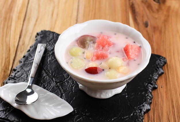 Sop Buah or Es Buah is Mixed Fruit with Coconut or Simple Syrup, Served with Shaved Ice and add Condensed Milk to Add Creamy Swetened, Popular for Buka Puasa (Breaking the fast)