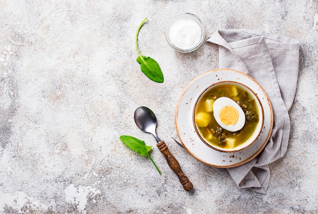 Sorrel soup or green borscht with eggs