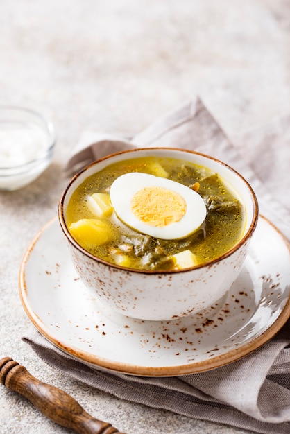 Sorrel soup or green borscht with eggs