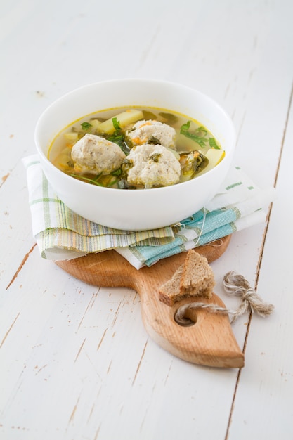 Sorrel soup in white bowl