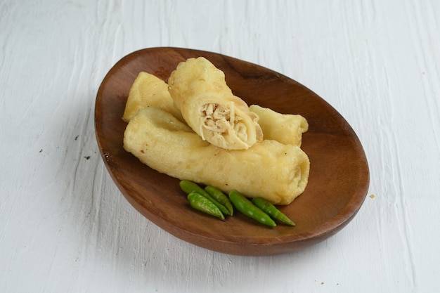 sosis solo is an indonesian traditional snackrolled crepes filled with spice ground meat or chicken