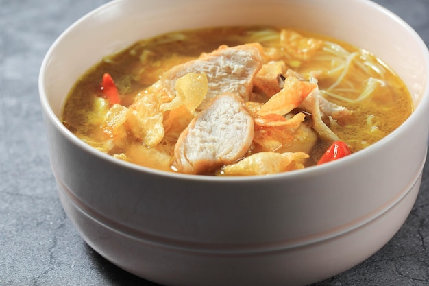 Soto Ayam Kuning an Indonesian Traditional Soup Made from CHicken Broth with Yellow Spice