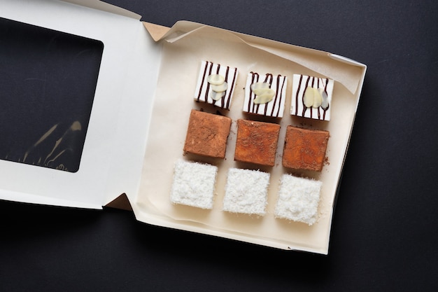 Souffle milk sweets in chocolate, coconut or cocoa. Sweets are packed in a gift box. Dessert bigeonÃÂÃÂÃÂÃÂ¢ÃÂÃÂÃÂÃÂÃÂÃÂÃÂÃÂs milk as a gift.