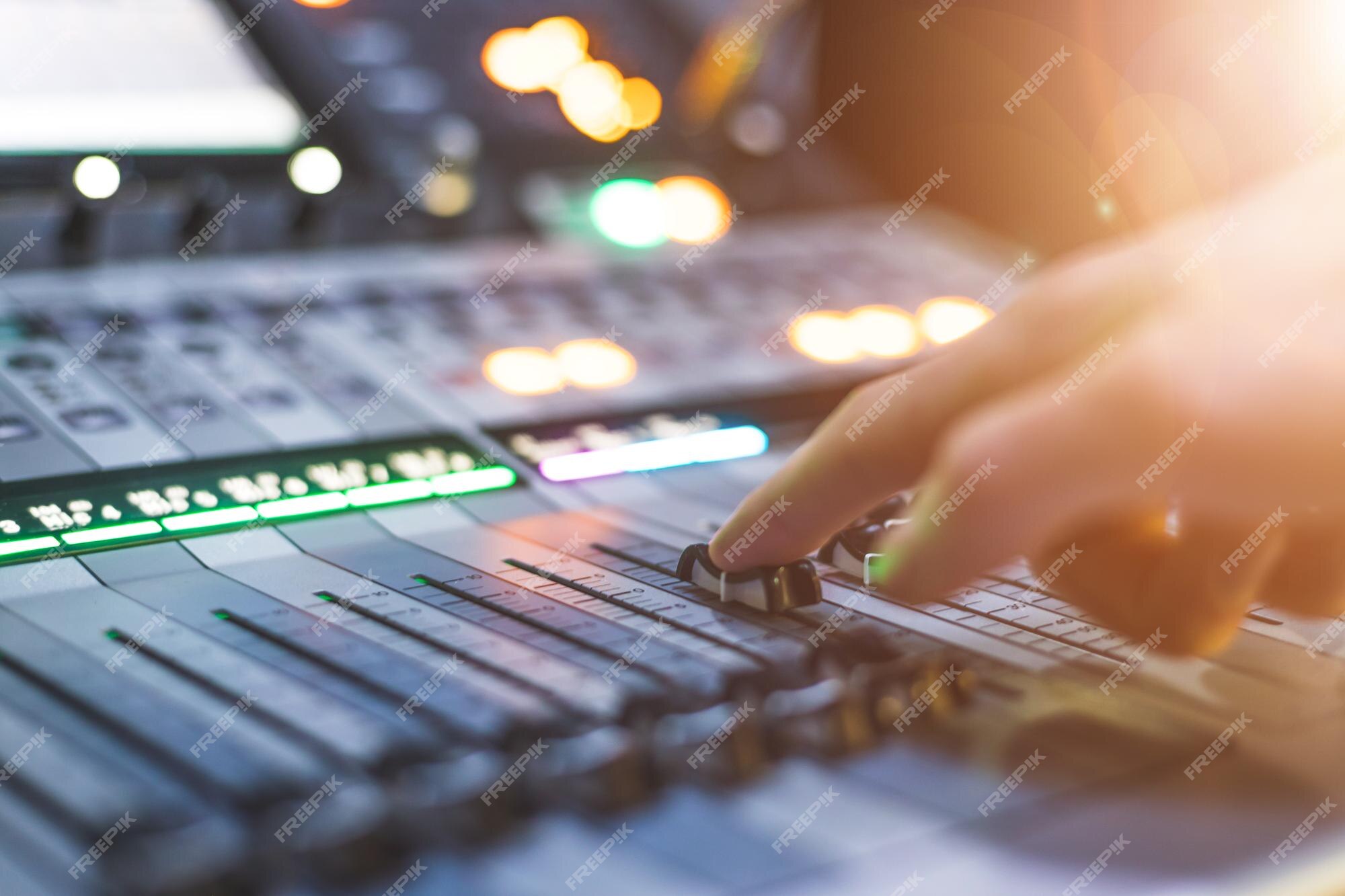 Premium Photo | Sound recording studio mixer desk sound engineer is  operating a professional music production