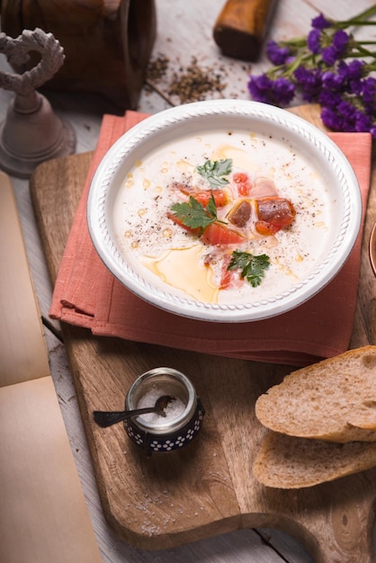 Soup puree with salmon in a ceramic bowl