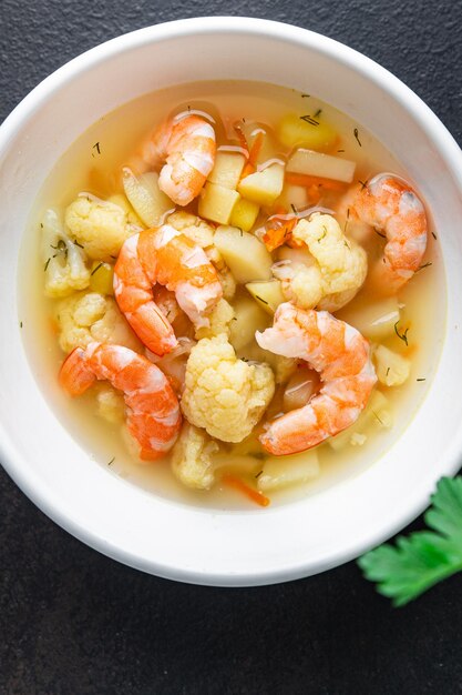 Soup seafood shrimp vegetable healthy meal diet snack on the table copy space food background