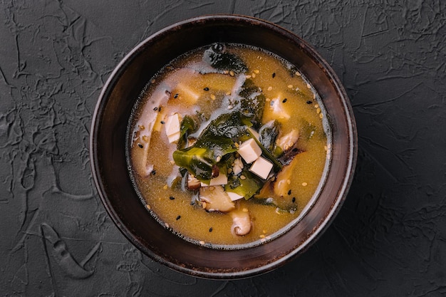 Soup with algae and mushrooms top view