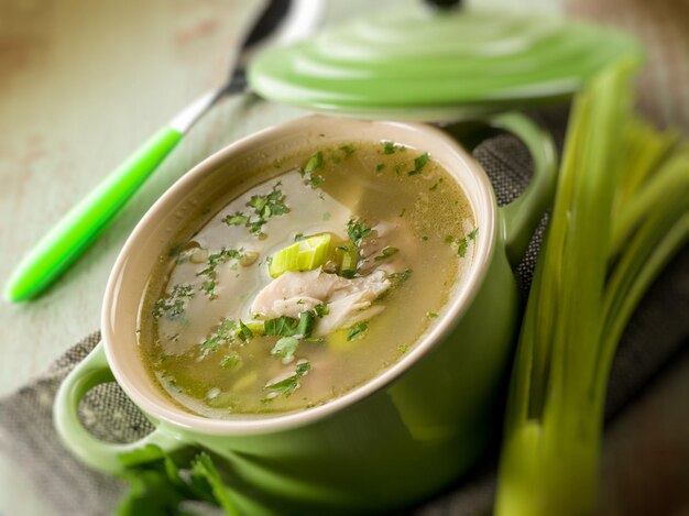 Soup with chicken and leek selective focus