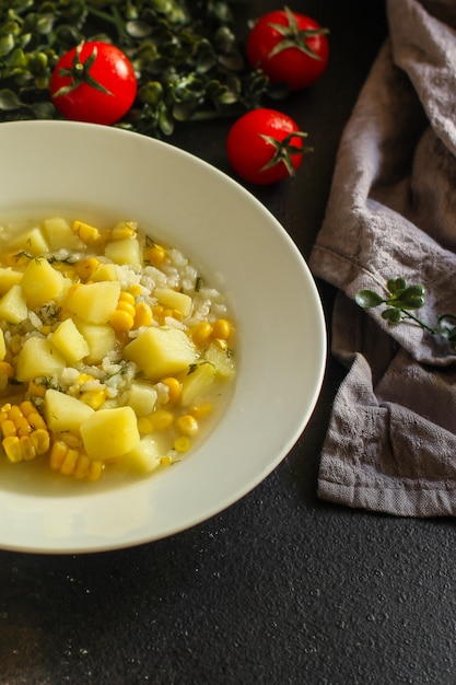 Soup with corn and vegetables (first course, vegetarian dish)