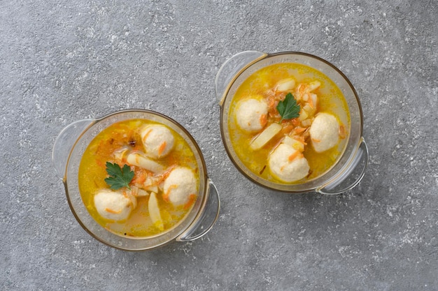 Soup with meatballs and herbs