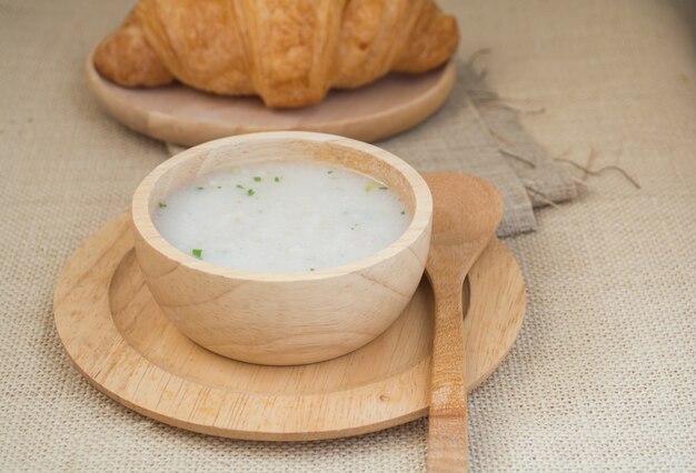 Soup in a wood cup and bread