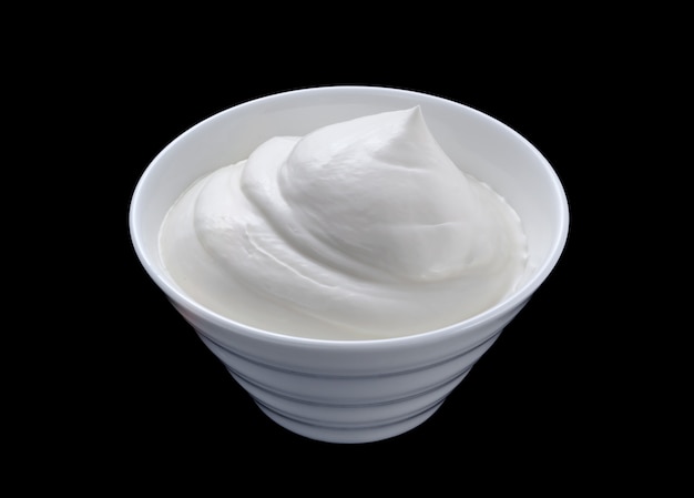 Photo sour cream in white bowl isolated on black