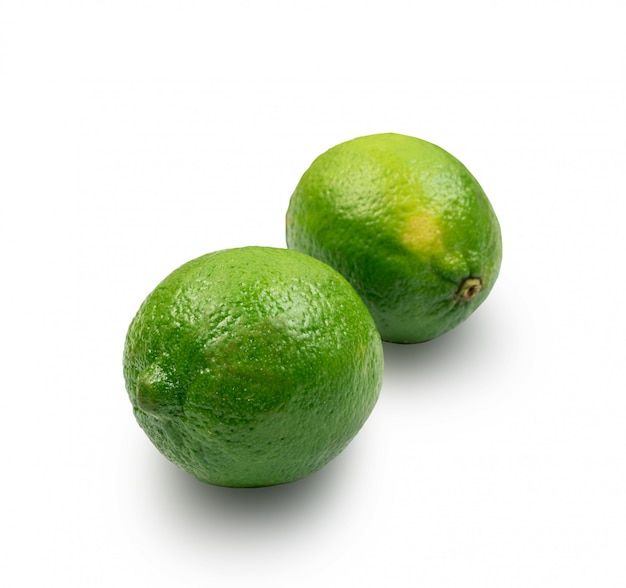 Photo sour key one whole lime isolated on white background