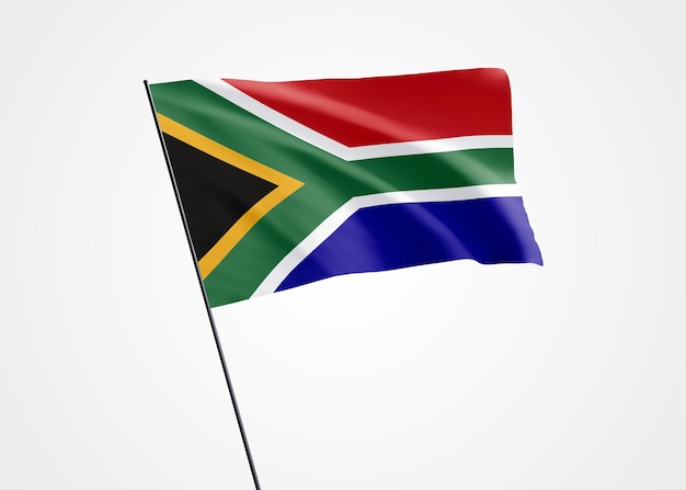 孤立した背景に高く飛んでいる南アフリカの旗 12 月 11 日南アフリカ独立記念日
