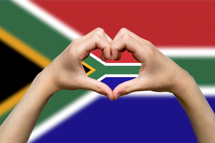 Photo south africa flag with two hands heart shape support or donate to south africa patriotism and