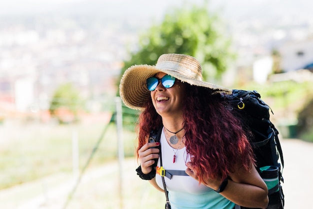 Photo south american latin middle aged female portrait hiking in active travel tourist adventure